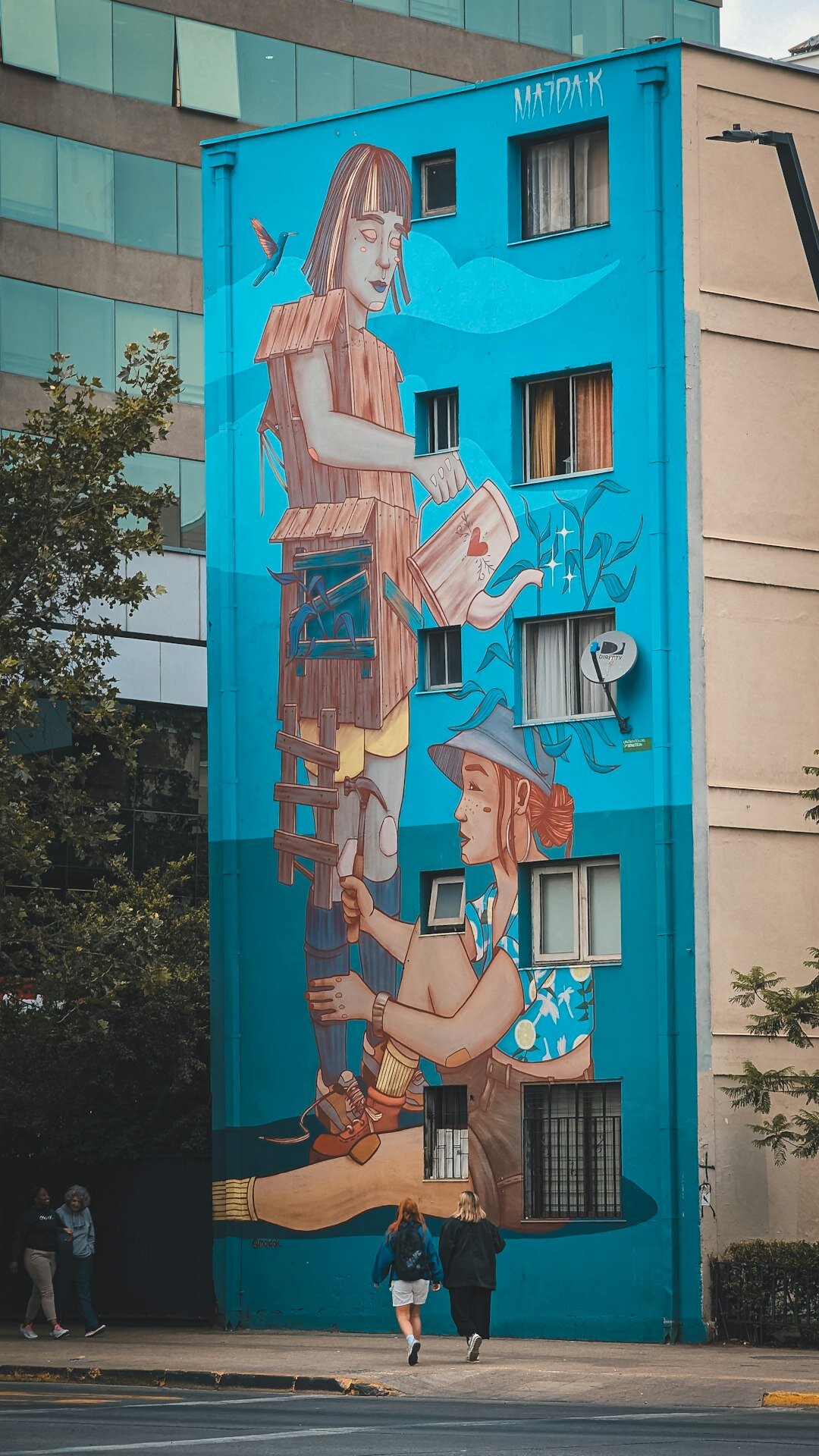 Large street art mural on a building wall in Barrio Bellas Artes, Santiago